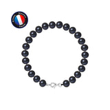 Le bracelet Perlinea NOELYSE est composé de perles noires mates de 7/8 mm et d'un fermoir mousqueton argenté, sur fond blanc. Le logo circulaire bleu "Artisan Bijoutier Français" apparaît dans le coin supérieur gauche.