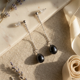 Boucles d'oreilles pendantes LOLITA | Or Blanc & Perles Noires