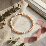 Bracelet en perles de culture multicolores roses et blanches avec fermoir en argent 925.