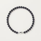 Bracelet perles noires 5/6 mm en argent 925 avec fermoir mousqueton argenté.
