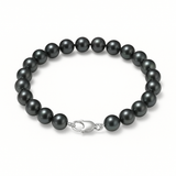 Bracelet en argent 925 orné de perles noires 6/7 mm avec fermoir mousqueton.