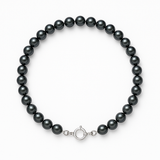 Bracelet en argent 925 et perles noires 4/5 mm avec fermoir anneau.