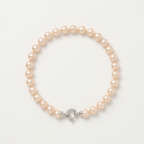 Bracelet perles roses en or blanc 9 carats avec fermoir anneau ressort argenté.